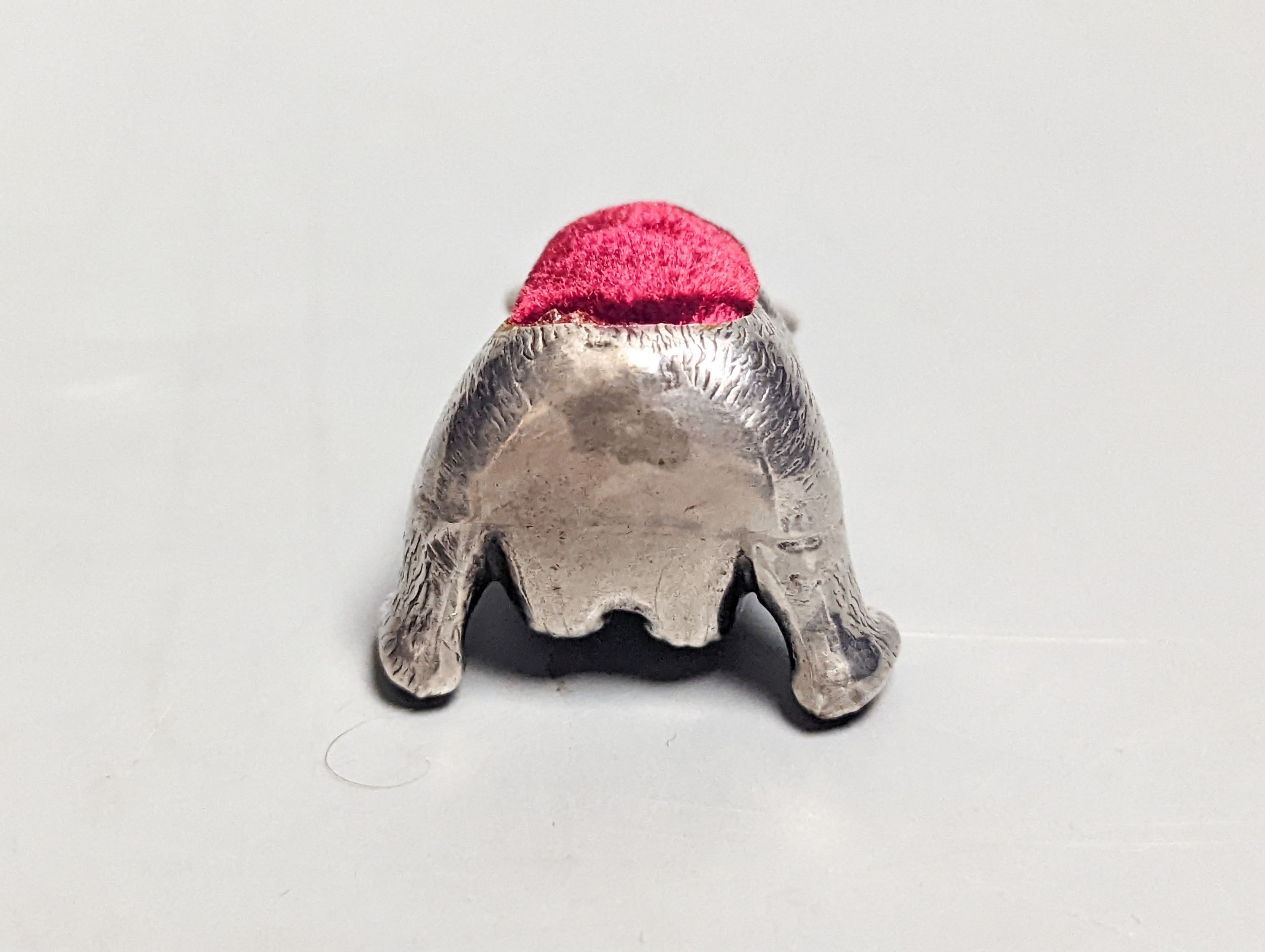 An Edwardian novelty silver 'teddy bear' pin cushion, with later cushion, W.J. Myott & Co, Birmingham, 1909, 36mm.